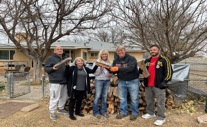 Family receiving firewood delivery